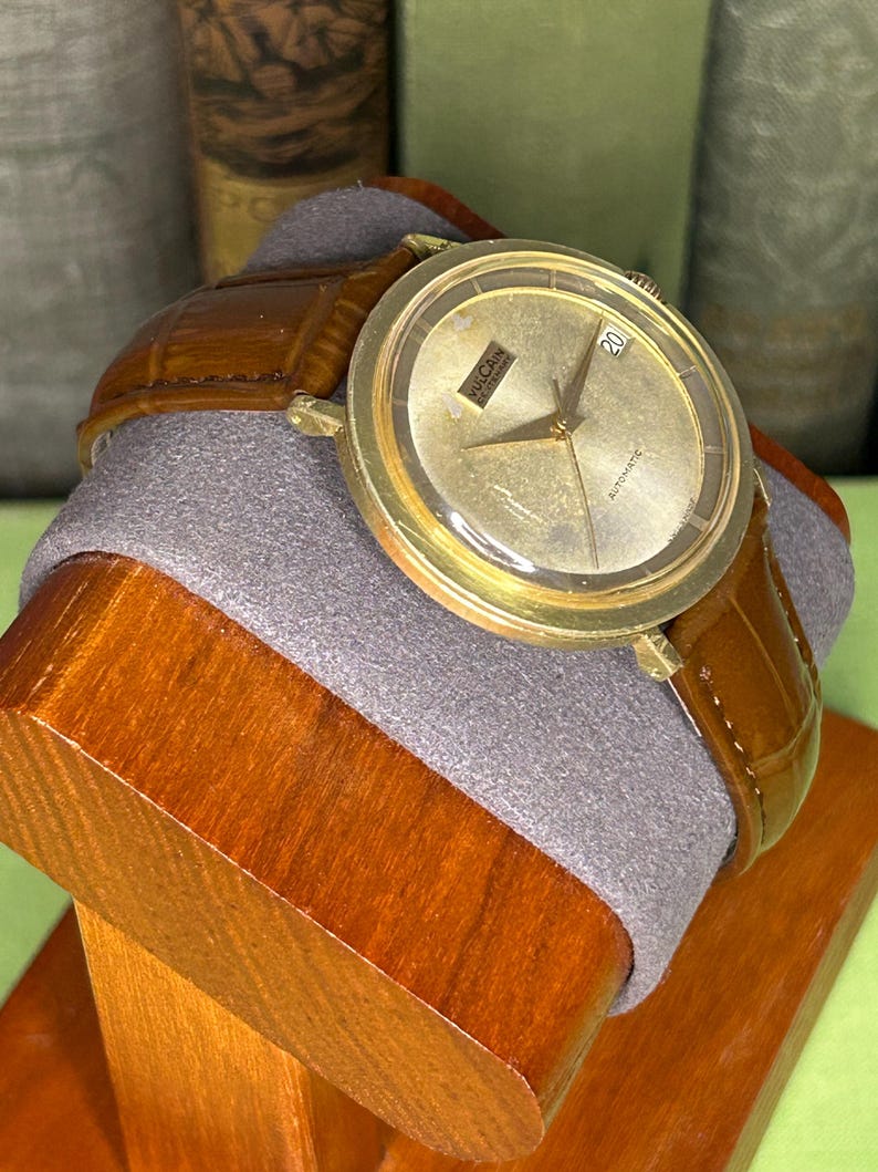 Vintage Vulcain Centenary automatic watch with gold plated case and brown leather strap.  Serviced and running.  Keeps time. working