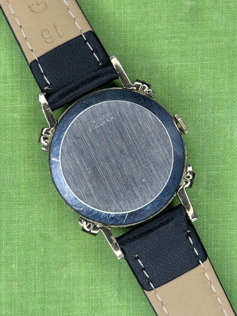 Vintage Benrus swiss watch with gold plated case and small seconds patina dial. New black leather band. Running, serviced, keeps time, working.