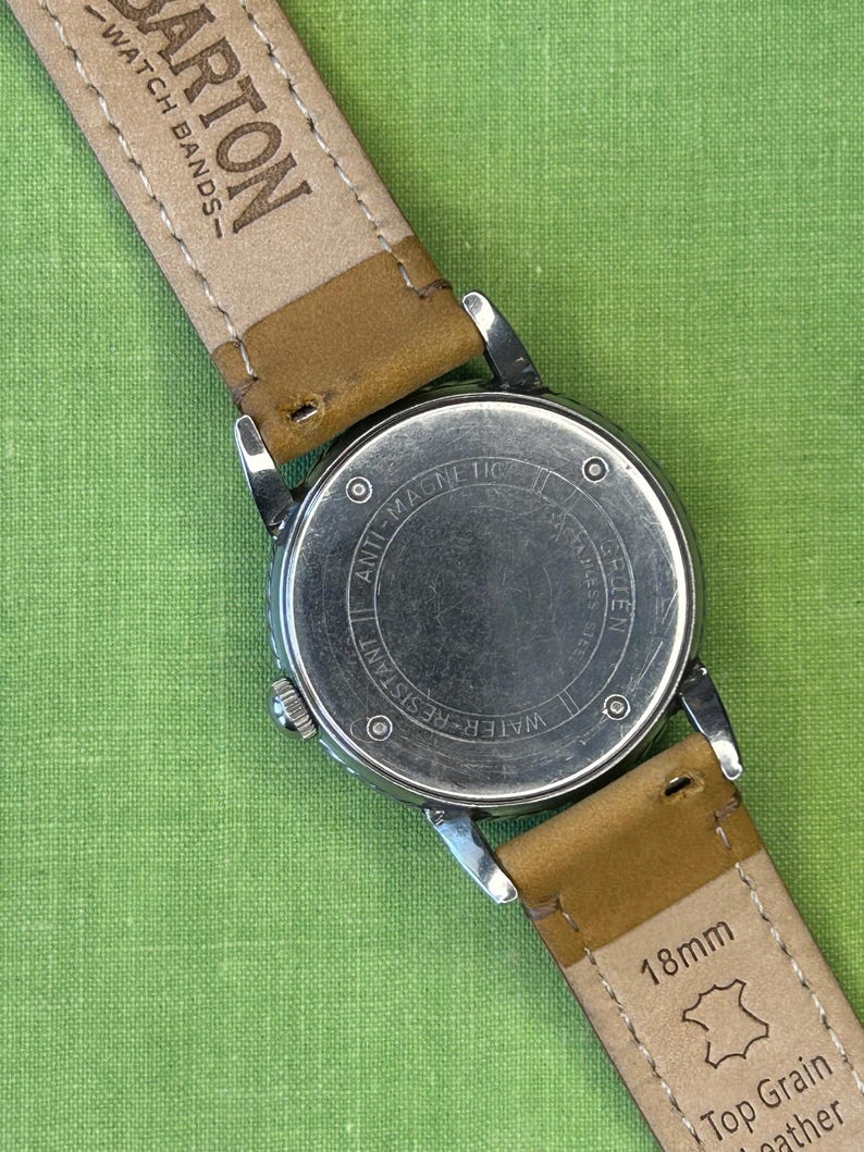 Vintage 1950s Gruen Veri-Thin Submarine Stainless Steel watch and small seconds patina dial. brown leather band.  Running, serviced, keeps time, working.