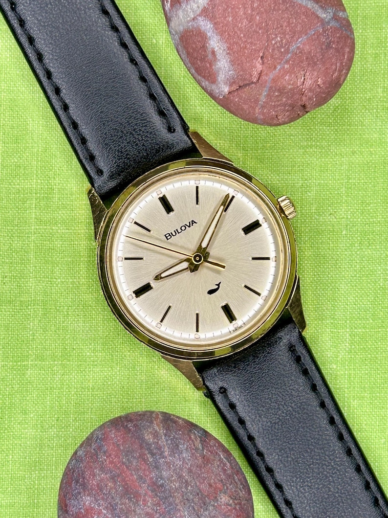 Vintage 1970 Bulova Sea King swiss watch with gold plated case and sweep seconds dial. New black leather band. Running, serviced, keeps time, working.