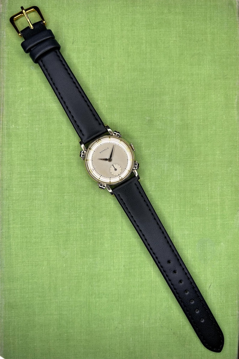 Vintage Benrus swiss watch with gold plated case and small seconds patina dial. New black leather band. Running, serviced, keeps time, working.