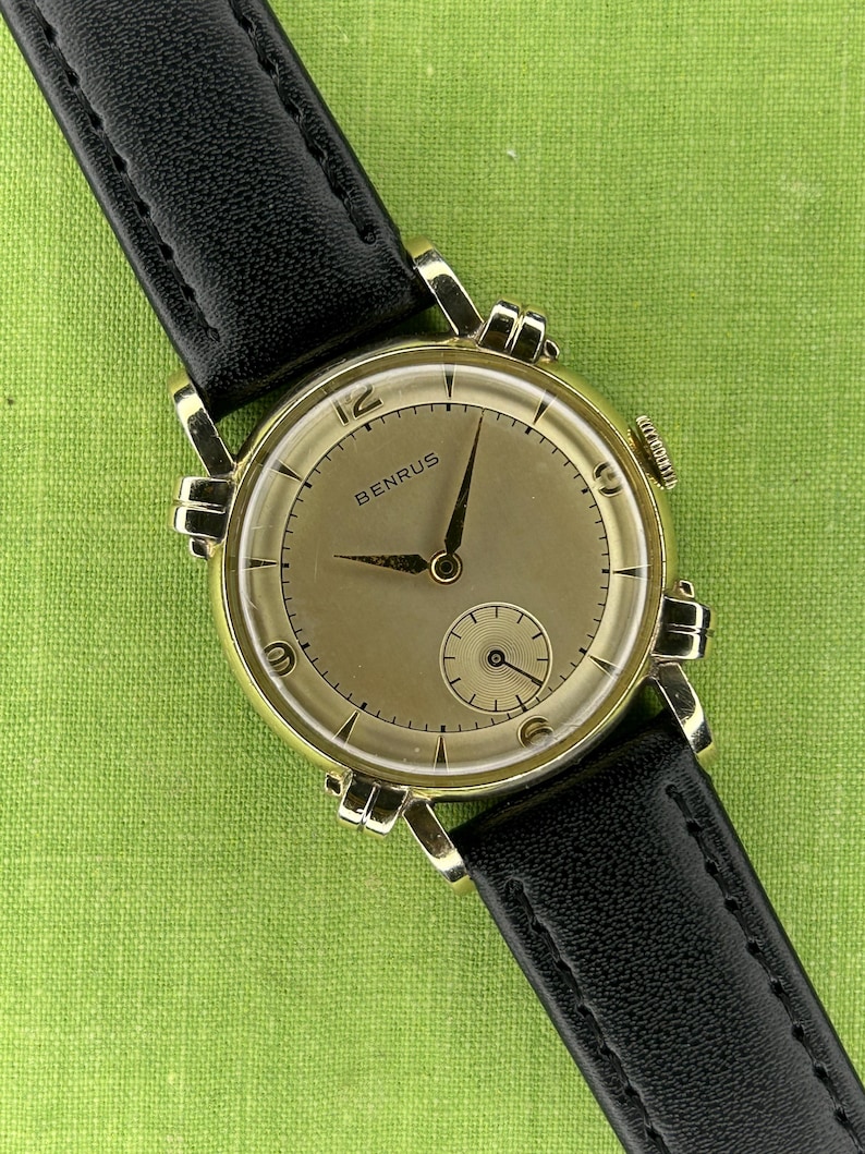 Vintage Benrus swiss watch with gold plated case and small seconds patina dial. New black leather band. Running, serviced, keeps time, working.