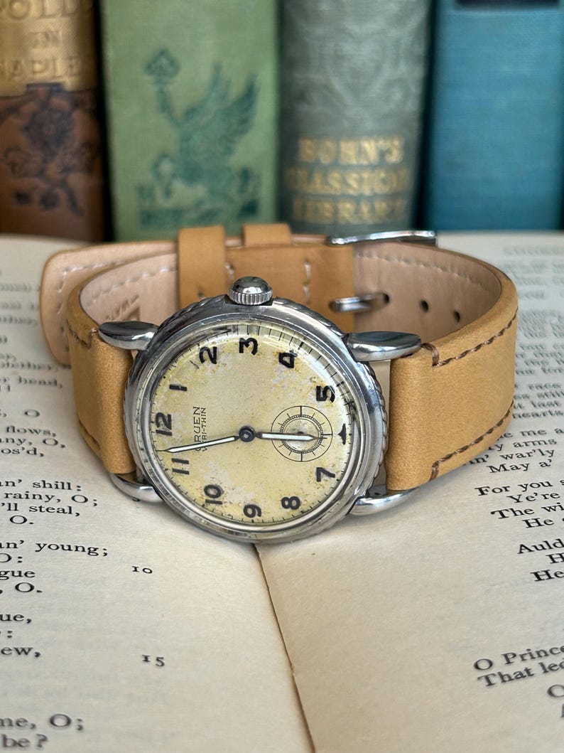 Vintage 1950s Gruen Veri-Thin Submarine Stainless Steel watch and small seconds patina dial. brown leather band.  Running, serviced, keeps time, working.
