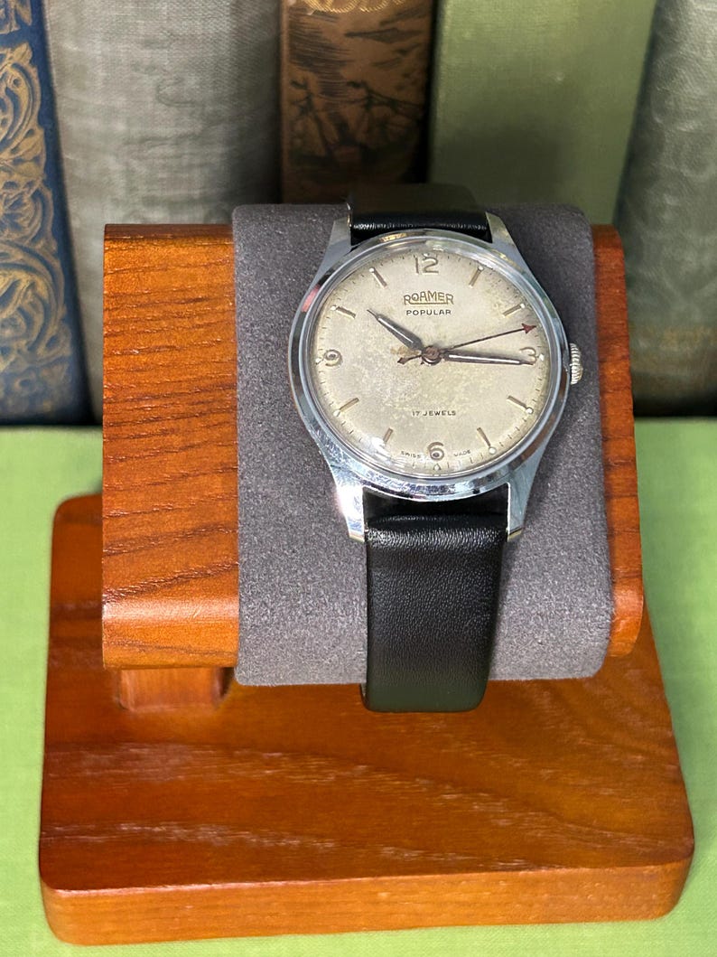 Vintage Roamer Popular watch.  black leather band.  Running, serviced working, keeping time.    Silver color case.