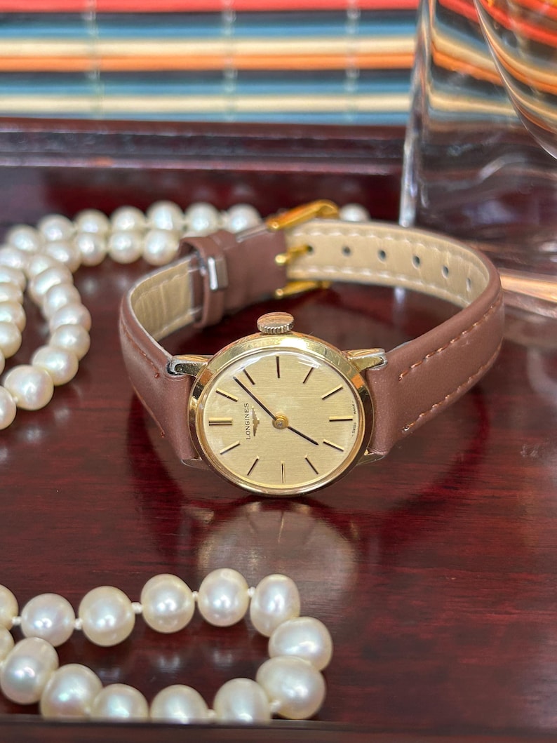 Vintage Longines ladies watch with gold plated case and gold dial. Mechanical  movement. Running, serviced, keeps time, working