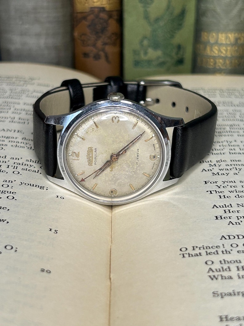 Vintage Roamer Popular watch.  black leather band.  Running, serviced working.    Silver color case.