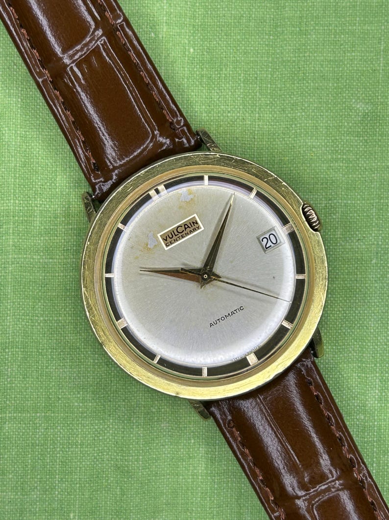 Vintage Vulcain Centenary automatic watch with gold plated case and brown leather strap.  Serviced and running.  Keeps time. working