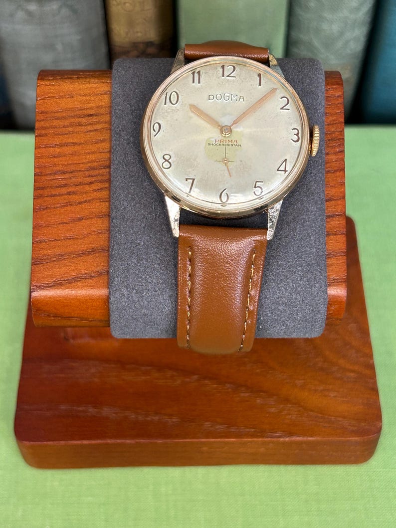 Vintage watch Dogma Prima jumbo swiss watch with rose gold plated case and small seconds dial.  New brown leather band. Running, serviced, keeps time, working.