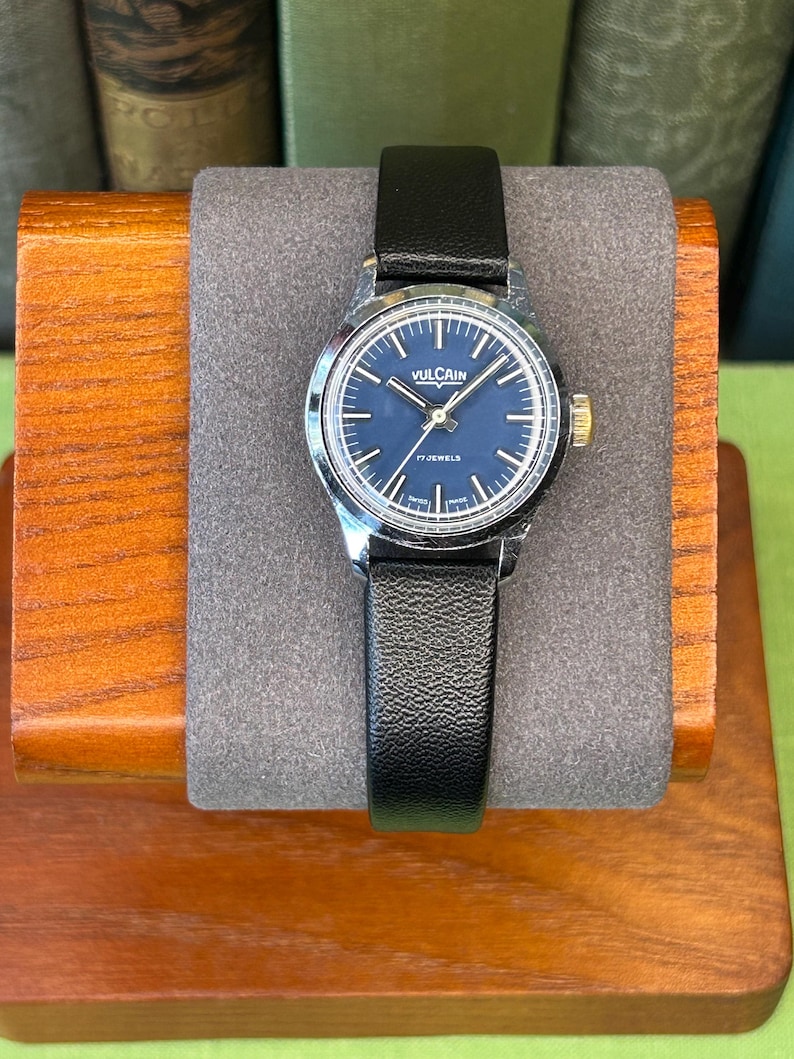 Vintage Vulcain Lady's watch with silver color case and black leather strap.  Serviced and running.  Keeps time. Working. Blue Dial