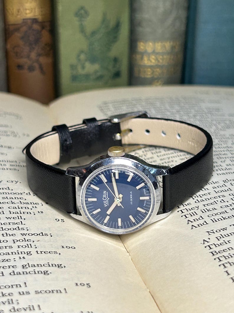 Vintage Vulcain Lady's watch with silver color case and black leather strap.  Serviced and running.  Keeps time. Working. Blue Dial