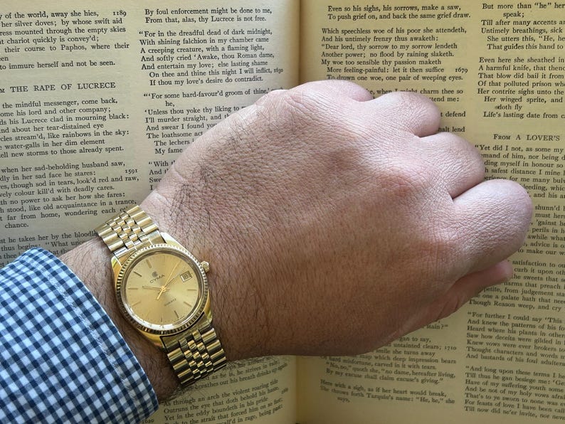 Vintage 1980s Cyma quartz watch with gold plated case and original bracelet. Just Serviced, Running and working great. Fresh battery.
