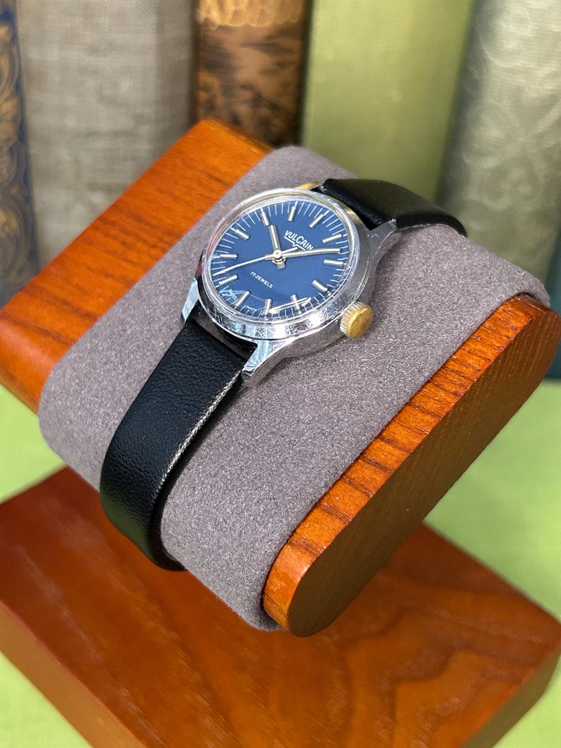 Vintage Vulcain Lady's watch with silver color case and black leather strap.  Serviced and running.  Keeps time. Working. Blue Dial