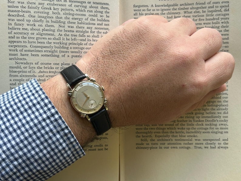 Vintage Benrus swiss watch with gold plated case and small seconds patina dial. New black leather band. Running, serviced, keeps time, working.