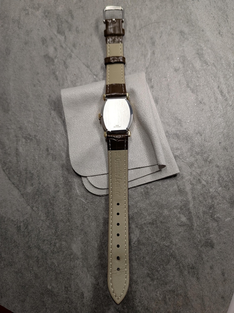 Benrus swiss tank watch with gold plated case and patina dial. New brown leather band. Running, serviced, keeps time, working