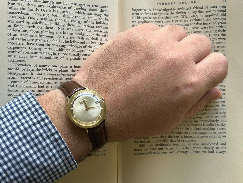 Vintage Vulcain Centenary automatic watch with gold plated case and brown leather strap.  Serviced and running.  Keeps time. working