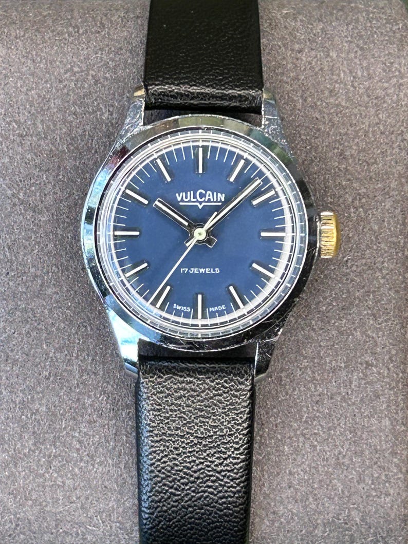 Vintage Vulcain Lady's watch with silver color case and black leather strap.  Serviced and running.  Keeps time. Working. Blue Dial