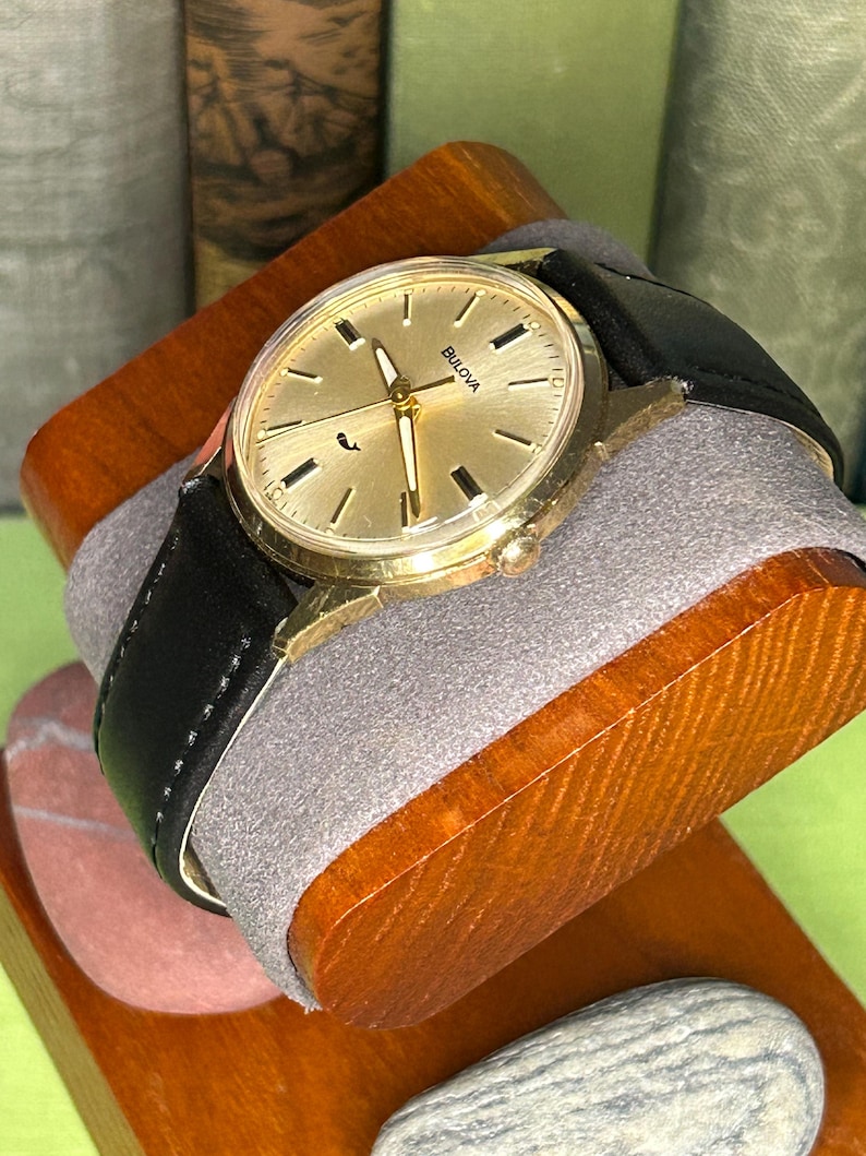 Vintage 1970 Bulova Sea King swiss watch with gold plated case and sweep seconds dial. New black leather band. Running, serviced, keeps time, working.