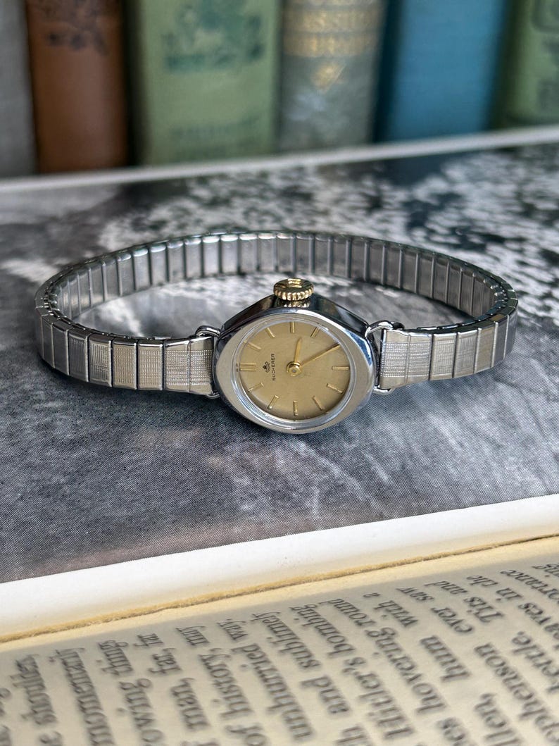 1970's Vintage Bucherer Ladies watch with Stainless Steel case and original bracelet.  Serviced and running.  Keeps time. works