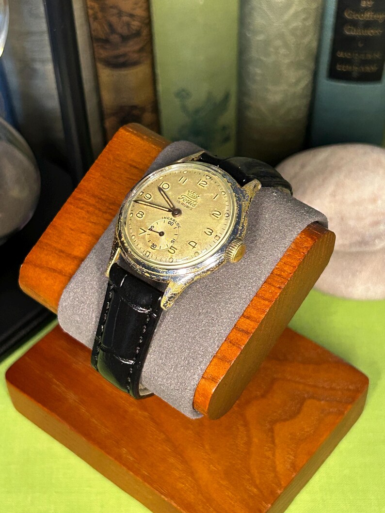1950s era Fortis swiss watch with chrome plated case and copper colored hands, patina dial. New black leather band. Running, serviced, keeps time, working
