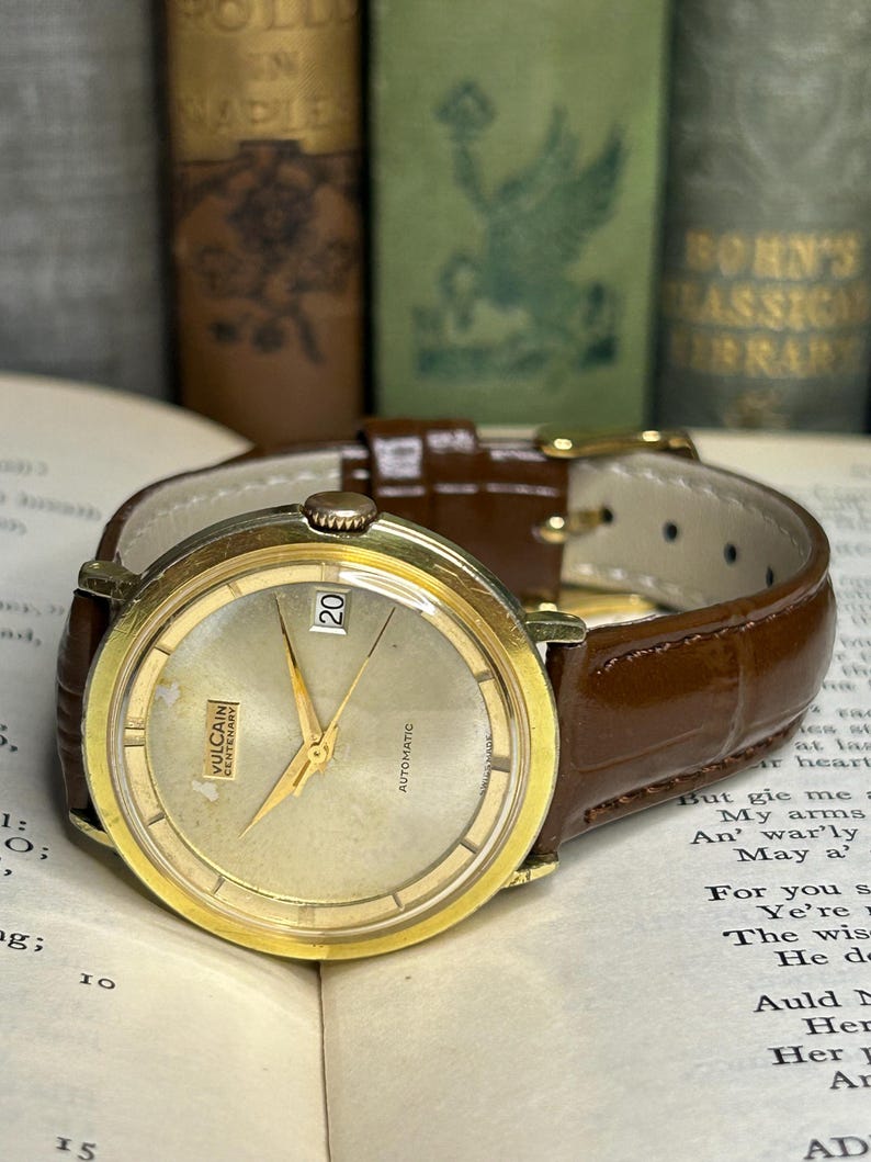 Vintage Vulcain Centenary automatic watch with gold plated case and brown leather strap.  Serviced and running.  Keeps time. working