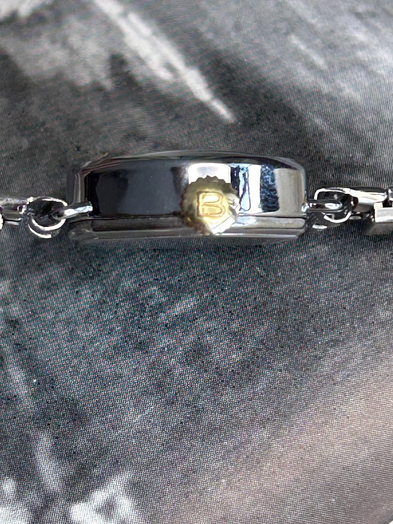 1970's Vintage Bucherer Ladies watch with Stainless Steel case and original bracelet.  Serviced and running.  Keeps time. works
