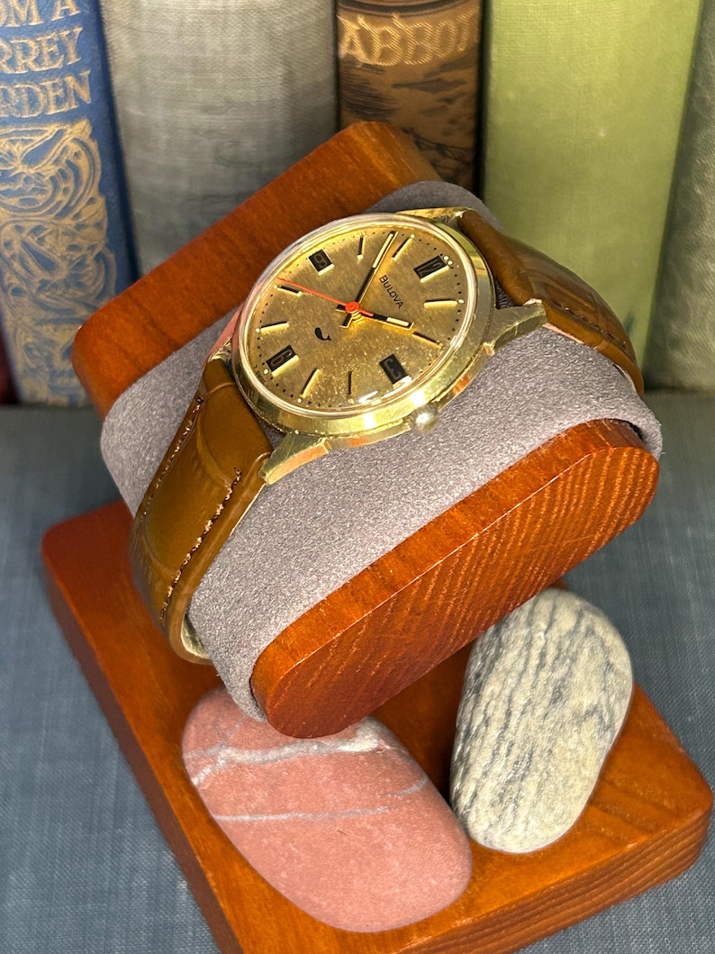 Vintage 1970 Bulova Sea King swiss watch with gold plated case and red sweep seconds dial. New brown leather band. Running, serviced, keeps time, working.
