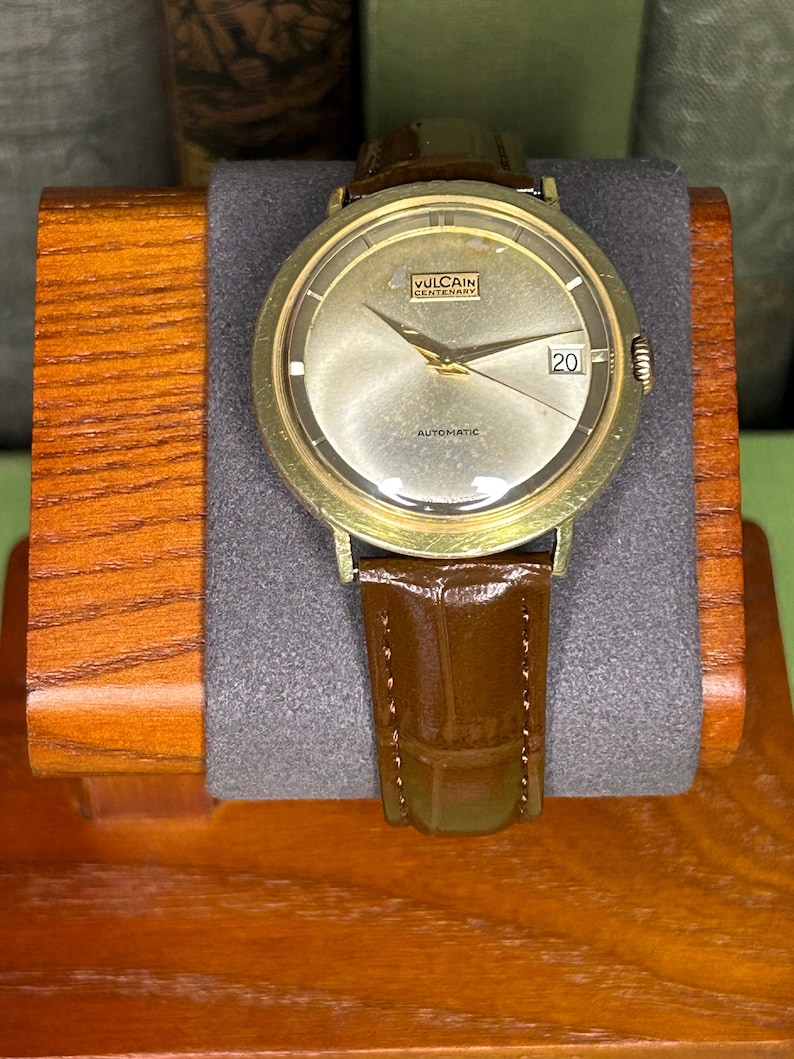 Vintage Vulcain Centenary automatic watch with gold plated case and brown leather strap.  Serviced and running.  Keeps time. working