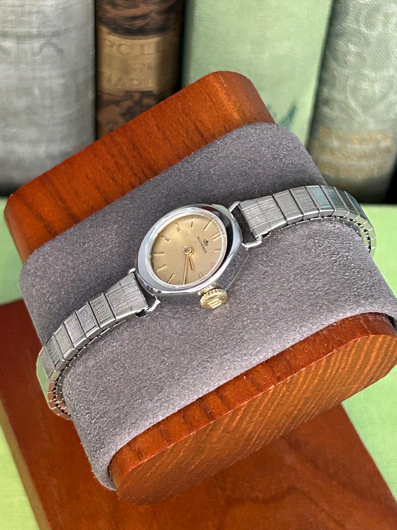 1970's Vintage Bucherer Ladies watch with Stainless Steel case and original bracelet.  Serviced and running.  Keeps time. works