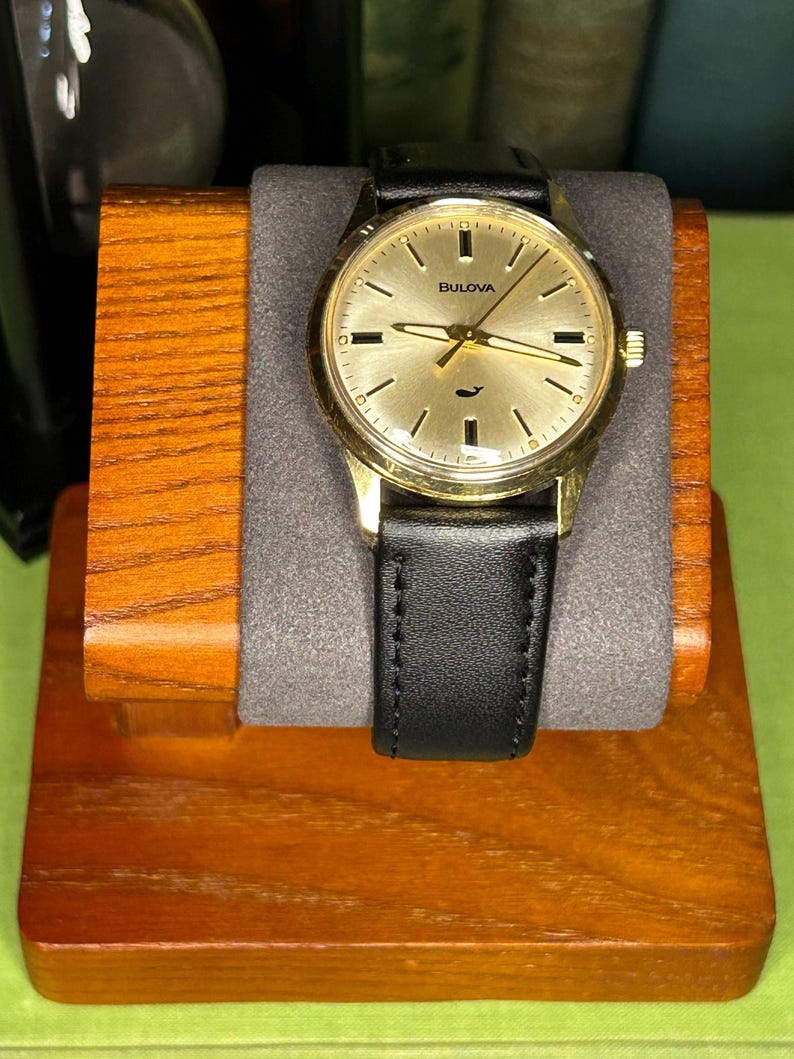 Vintage 1970 Bulova Sea King swiss watch with gold plated case and sweep seconds dial. New black leather band. Running, serviced, keeps time, working.