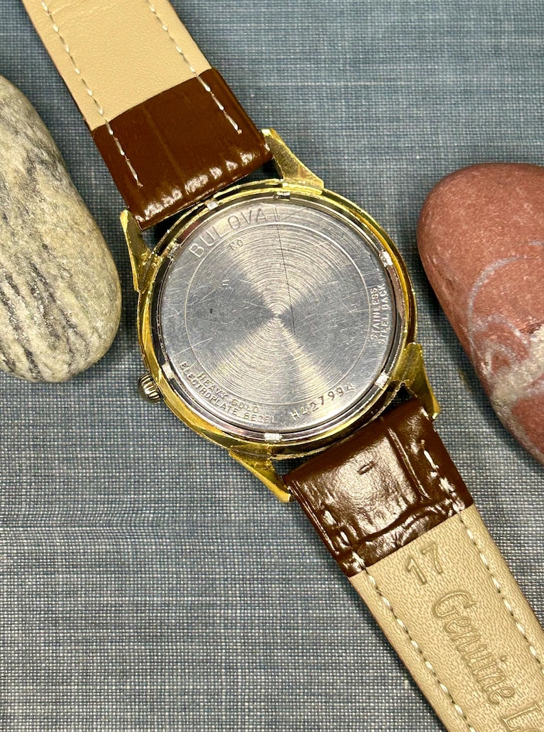 Vintage 1970 Bulova Sea King swiss watch with gold plated case and red sweep seconds dial. New brown leather band. Running, serviced, keeps time, working.
