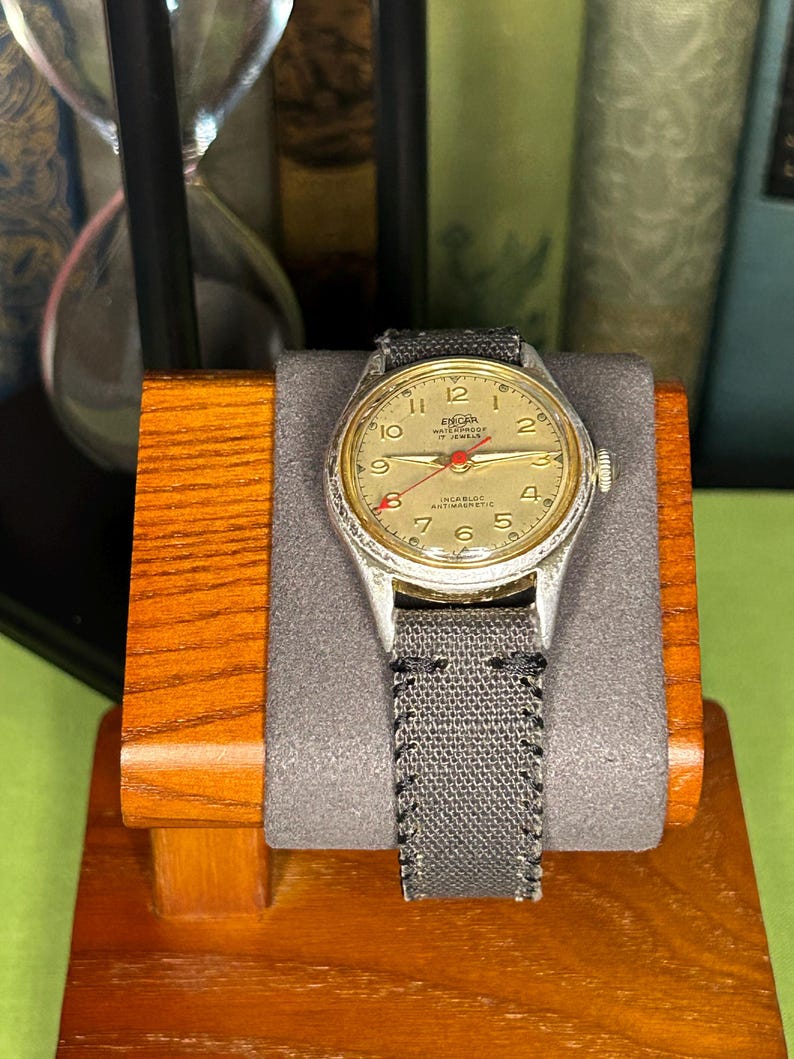 Vintage 1950s Enicar swiss watch with aluminum plated case and red sweep seconds dial. New grey canvas band. Running, serviced, keeps time, working.