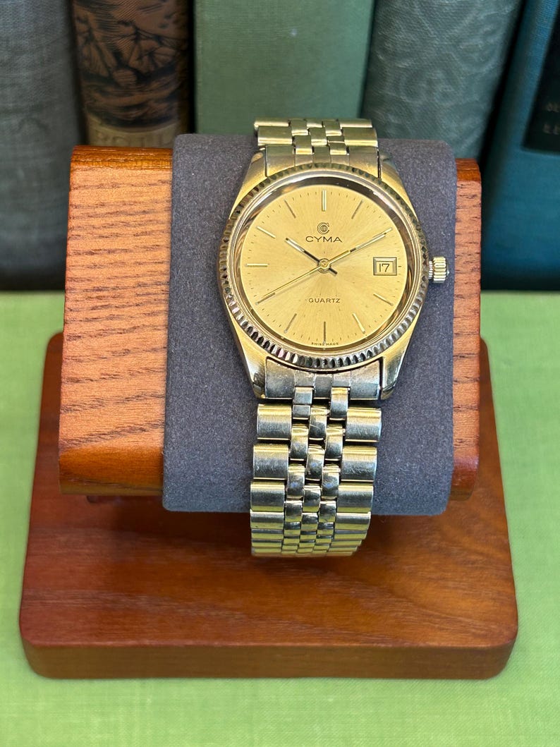 Vintage 1980s Cyma quartz watch with gold plated case and original bracelet. Just Serviced, Running and working great. Fresh battery.