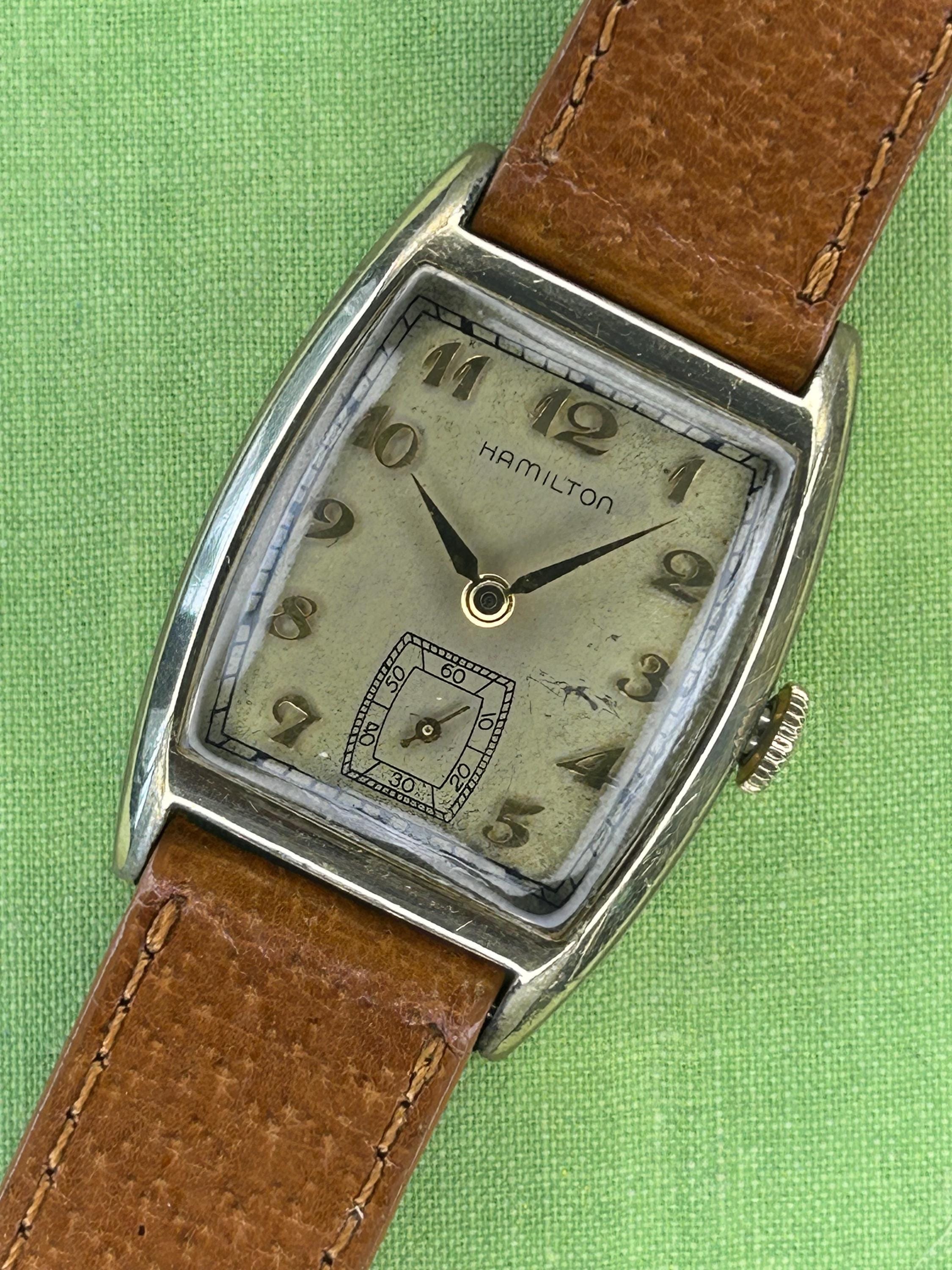 Vintage watch 1940's Hamilton Tank. Serviced, Running Great, keeps time! Gold filled with brown leather band. Beautiful patina dial!