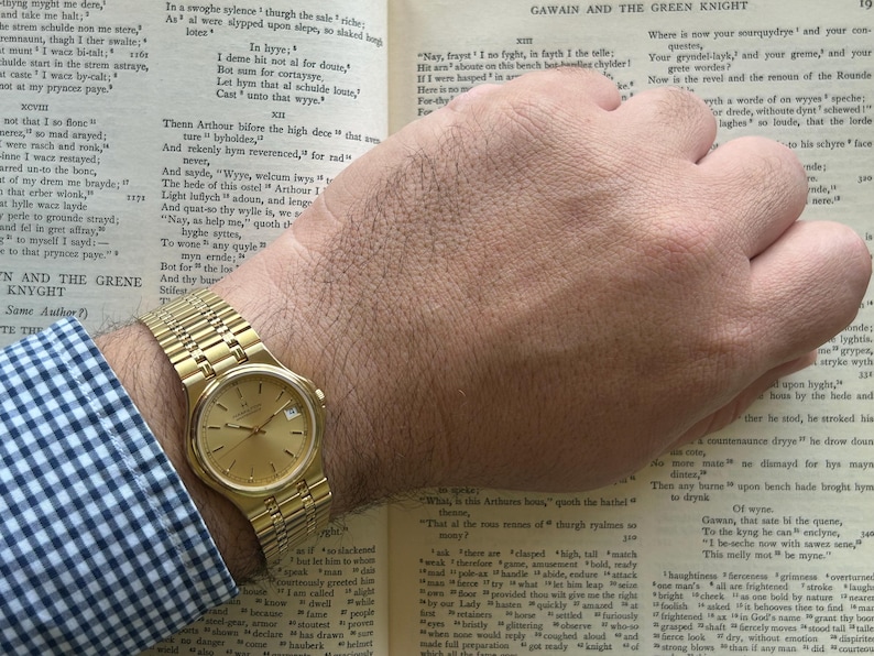 Hamilton Masterpiece Quartz watch model 9162a with gold plated case and original bracelet. Date window.  Running, keeping time, fresh battery.