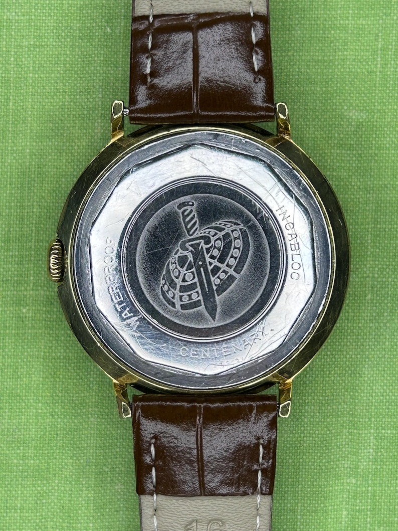 Vintage Vulcain Centenary automatic watch with gold plated case and brown leather strap.  Serviced and running.  Keeps time. working