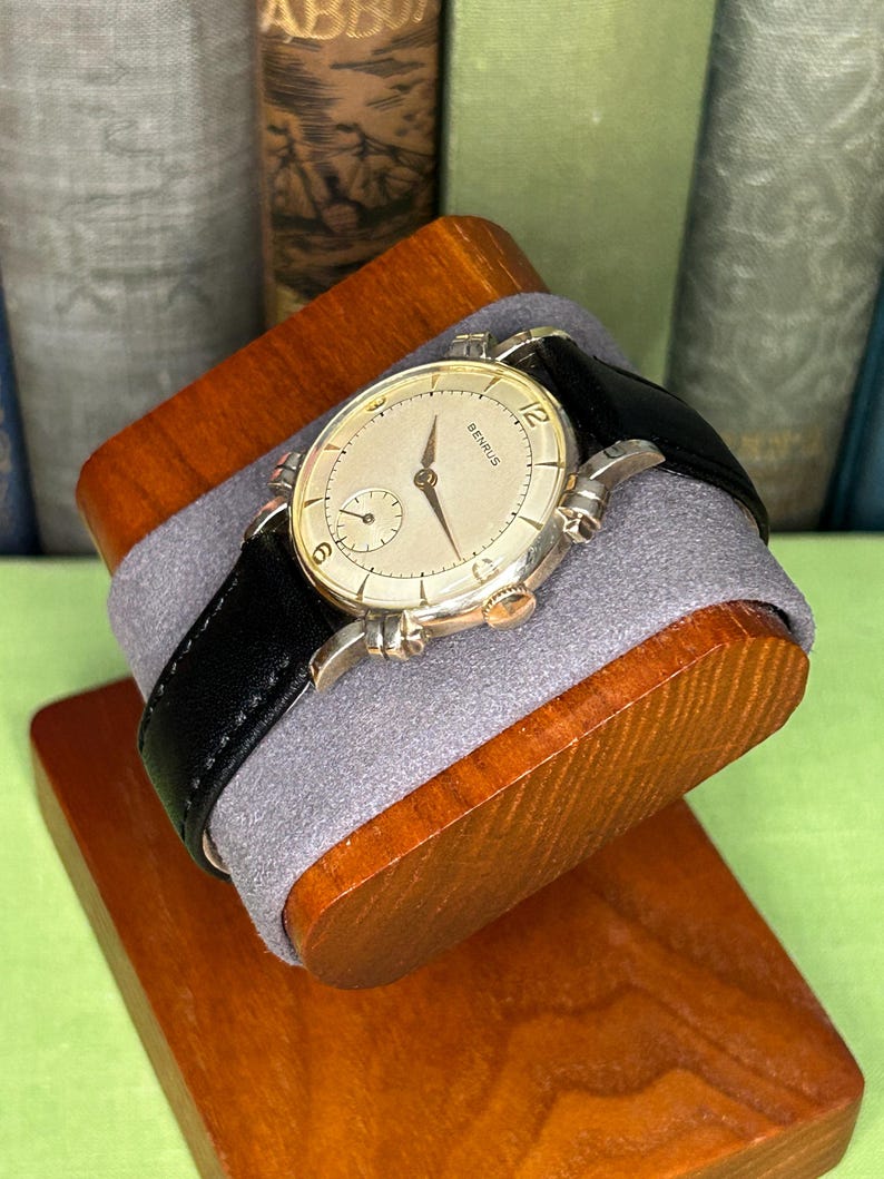 Vintage Benrus swiss watch with gold plated case and small seconds patina dial. New black leather band. Running, serviced, keeps time, working.