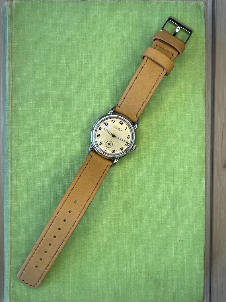 Vintage 1950s Gruen Veri-Thin Submarine Stainless Steel watch and small seconds patina dial. brown leather band.  Running, serviced, keeps time, working.
