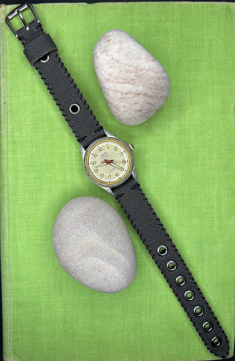 Vintage 1950s Enicar swiss watch with aluminum plated case and red sweep seconds dial. New grey canvas band. Running, serviced, keeps time, working.