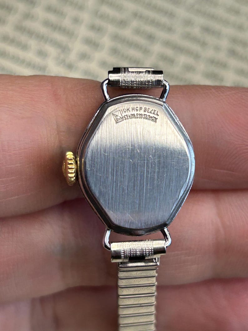 1970's Vintage Bucherer Ladies watch with Stainless Steel case and original bracelet.  Serviced and running.  Keeps time. works
