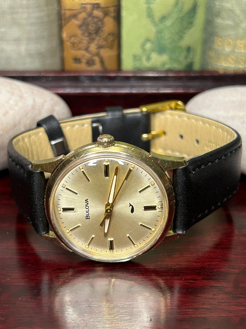 Vintage 1970 Bulova Sea King swiss watch with gold plated case and sweep seconds dial. New black leather band. Running, serviced, keeps time, working.
