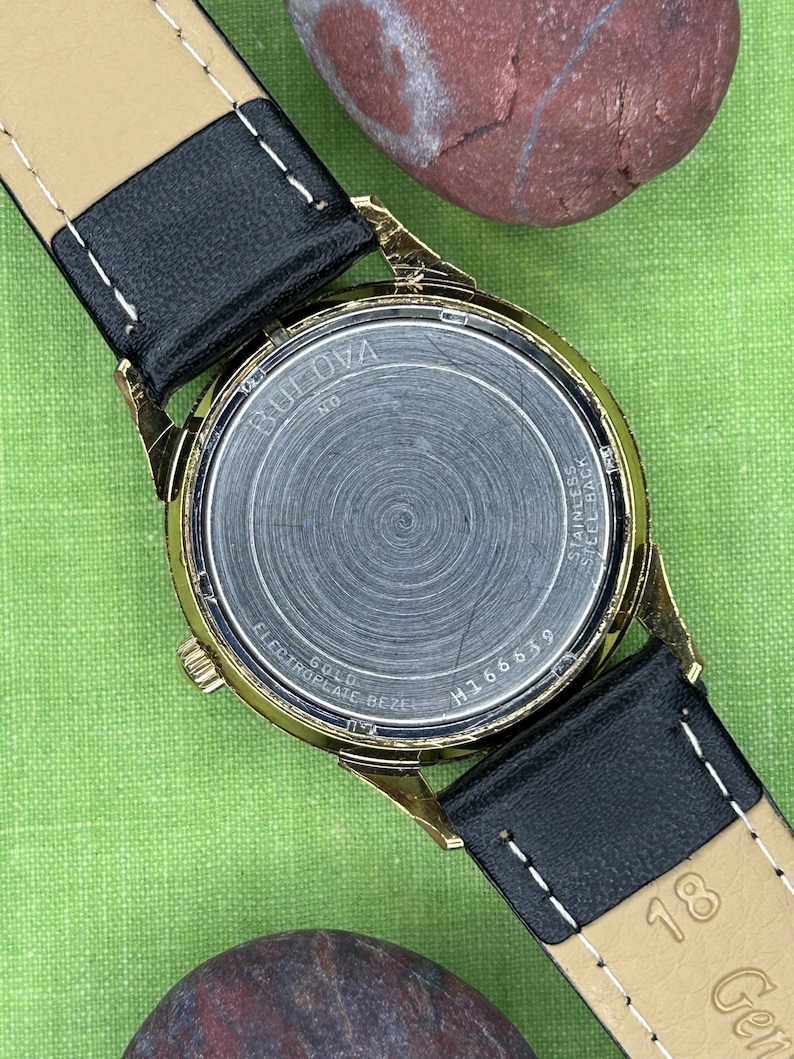 Vintage 1970 Bulova Sea King swiss watch with gold plated case and sweep seconds dial. New black leather band. Running, serviced, keeps time, working.
