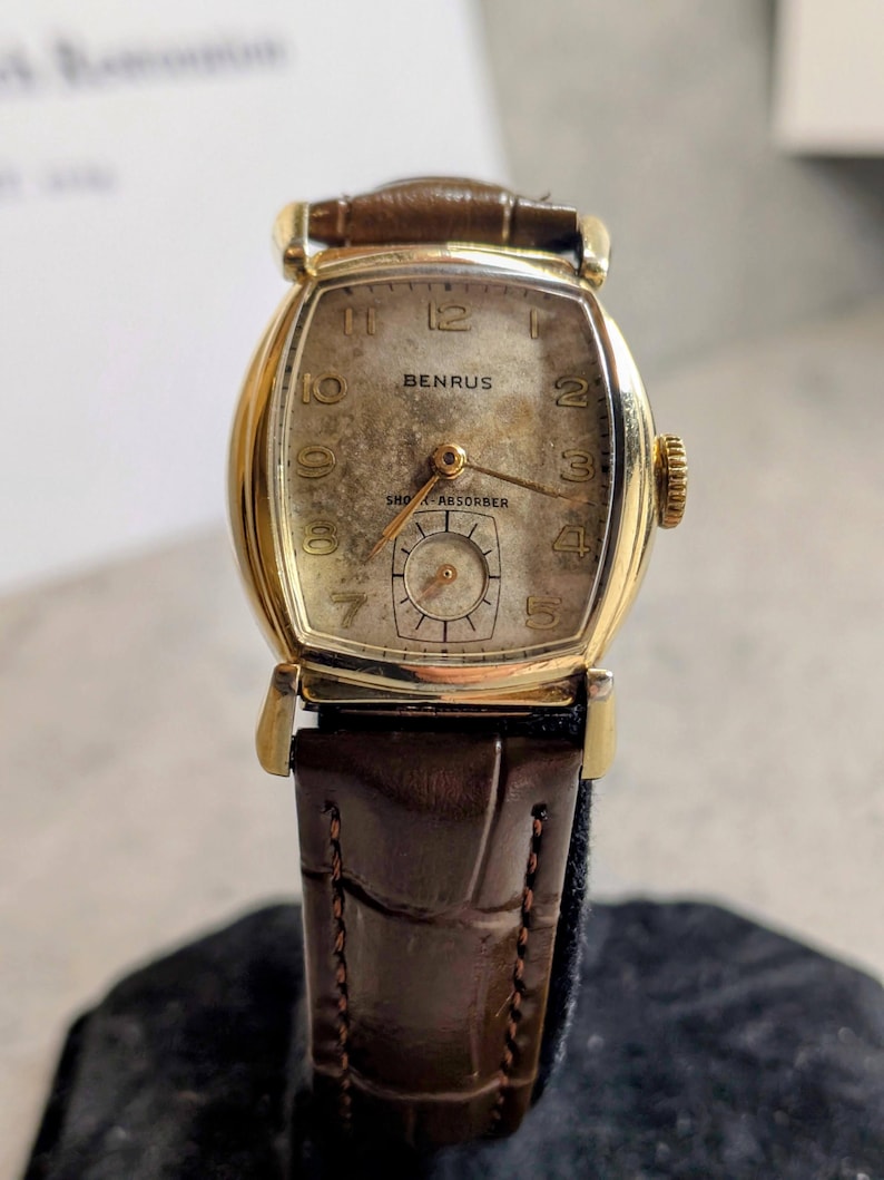 Benrus swiss tank watch with gold plated case and patina dial. New brown leather band. Running, serviced, keeps time, working