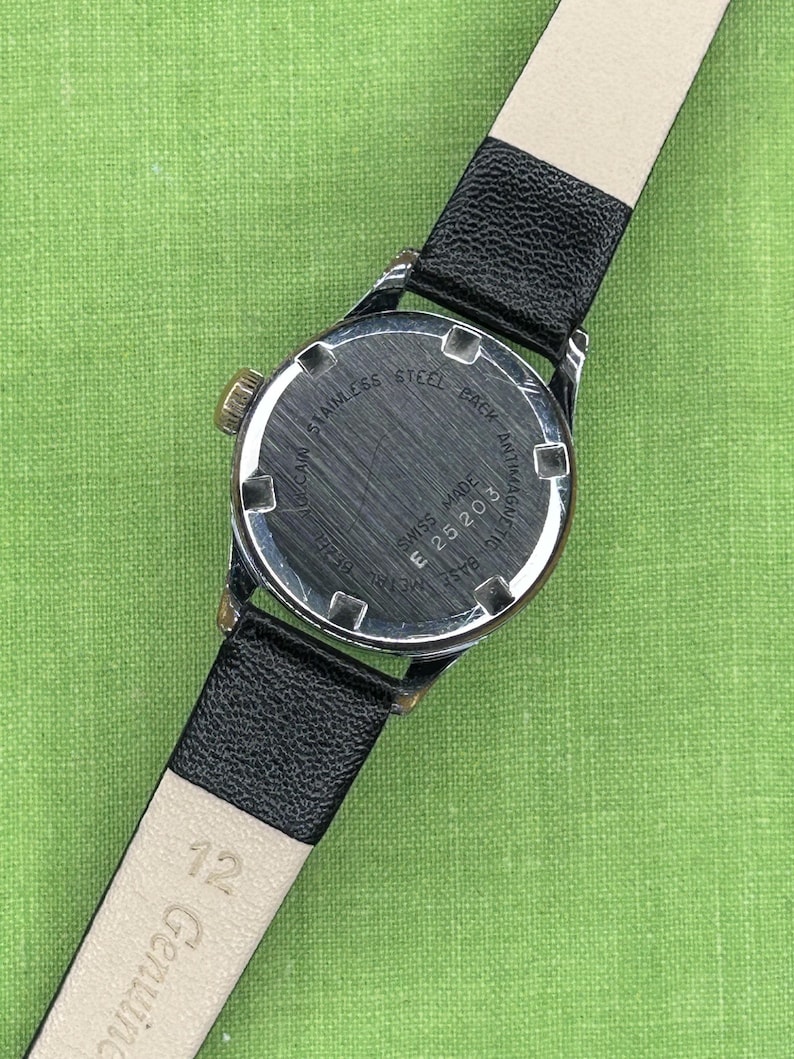 Vintage Vulcain Lady's watch with silver color case and black leather strap.  Serviced and running.  Keeps time. Working. Blue Dial