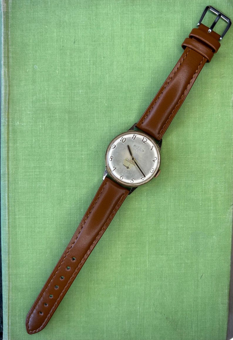 Vintage watch Dogma Prima jumbo swiss watch with rose gold plated case and small seconds dial.  New brown leather band. Running, serviced, keeps time, working.