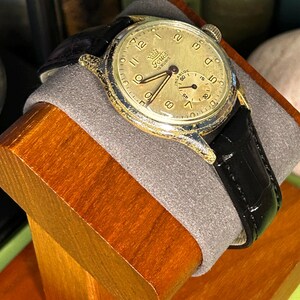 1950s era Fortis swiss watch with chrome plated case and copper colored hands, patina dial. New black leather band. Running, serviced, keeps time, working