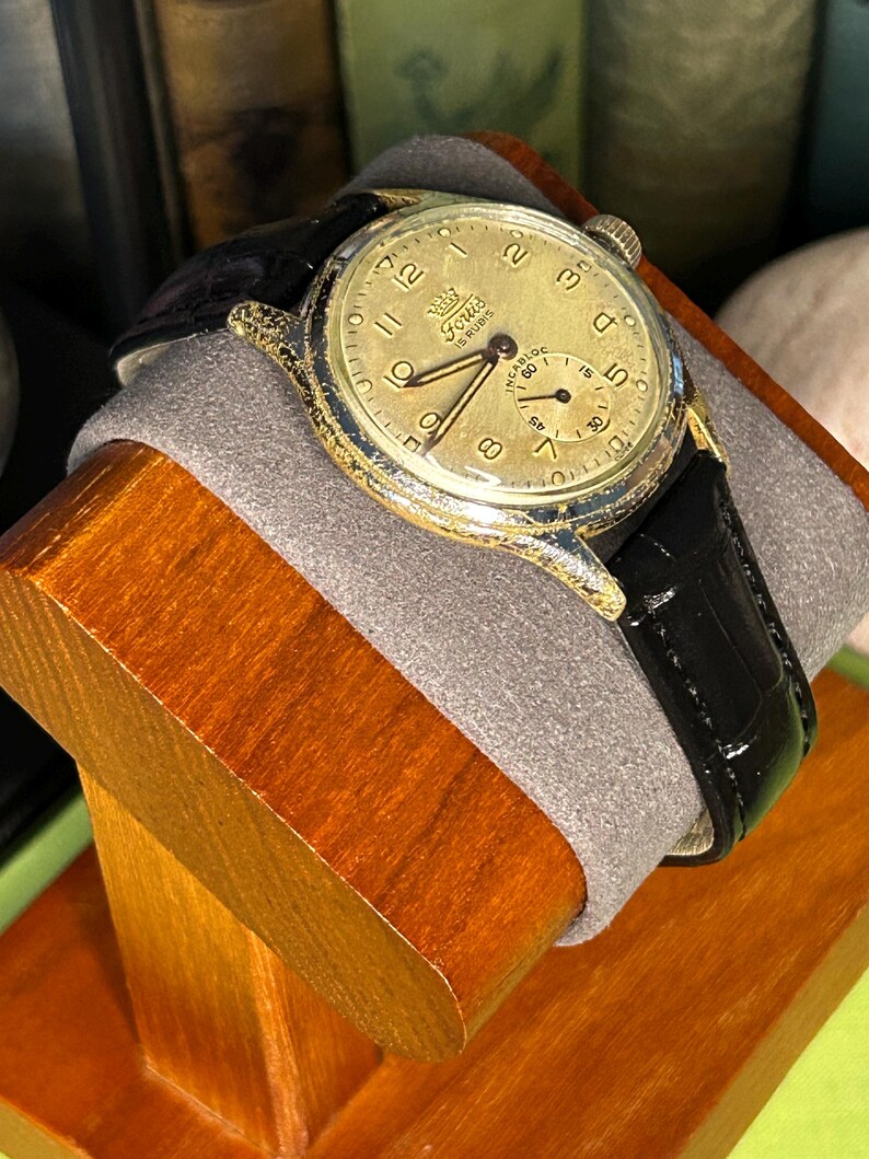 1950s era Fortis swiss watch with chrome plated case and copper colored hands, patina dial. New black leather band. Running, serviced, keeps time, working