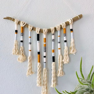 Yarn wrapped tassel wallhanging in cool neutrals image 1