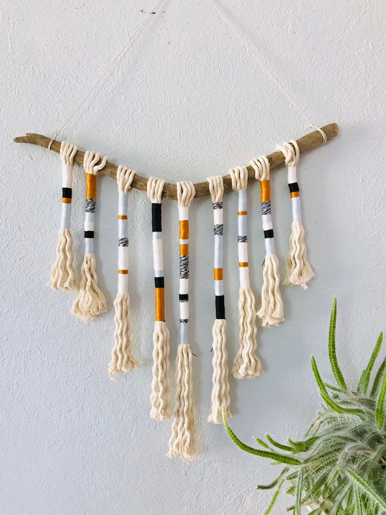 Yarn wrapped tassel wallhanging in cool neutrals image 1