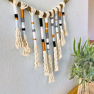 Yarn wrapped tassel wallhanging in cool neutrals image 3