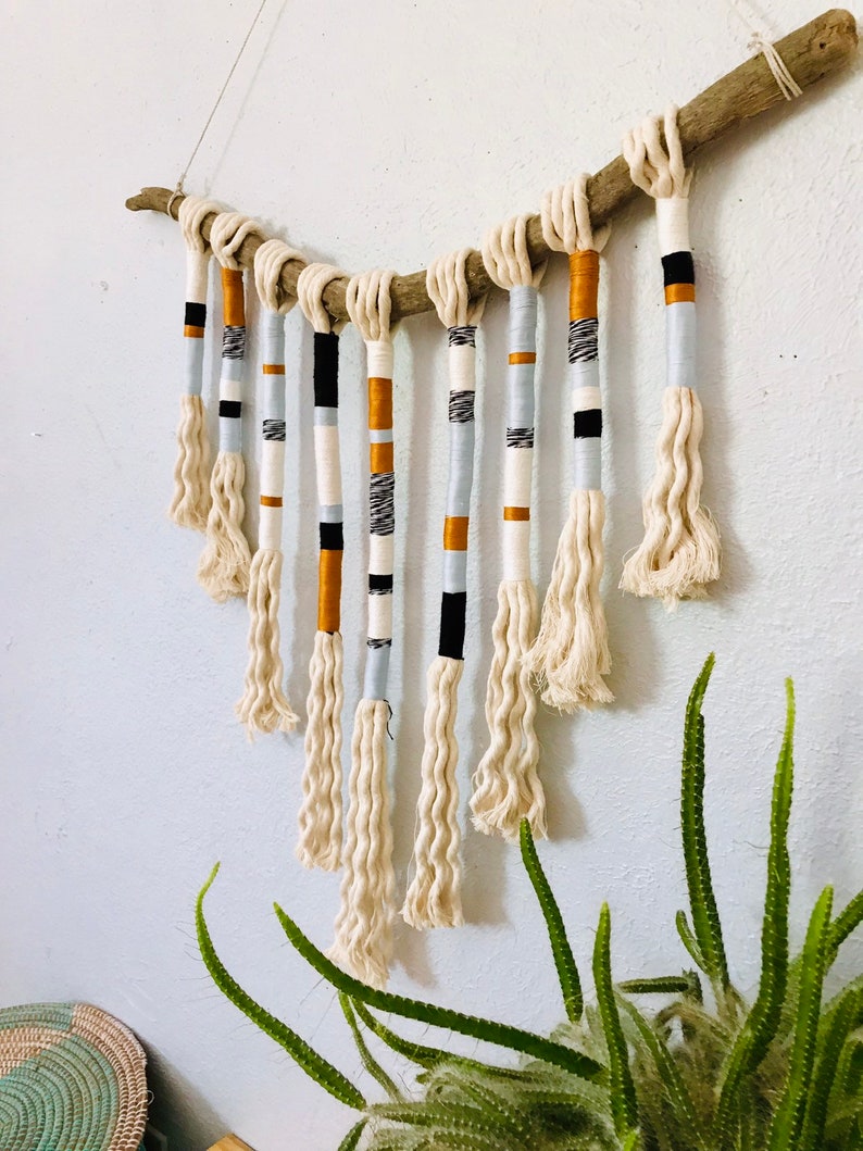 Yarn wrapped tassel wallhanging in cool neutrals image 2